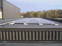 Solar Panel units on the roof of a building - horizontal view of roof of buidling