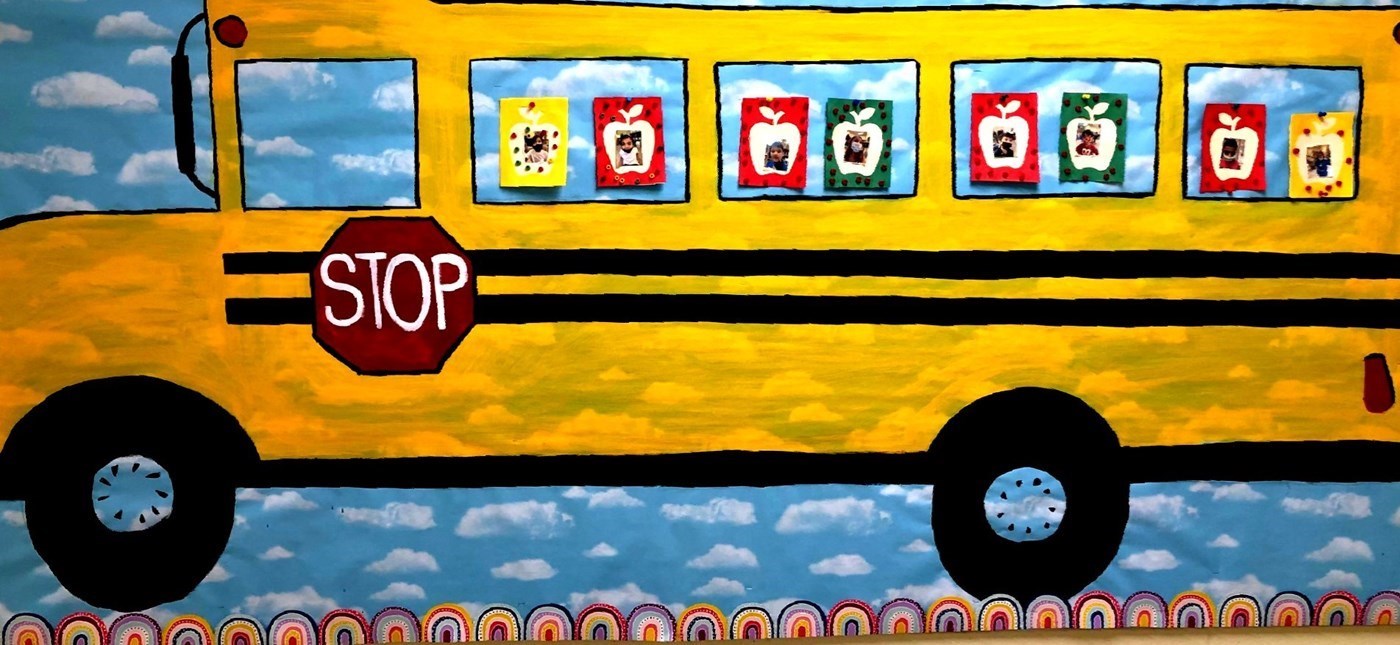 Painting of yellow school bus with stop sign on the side