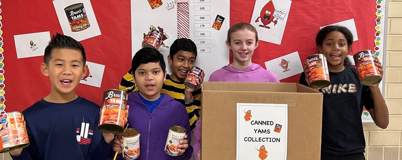 Students with cans of yams for our collection