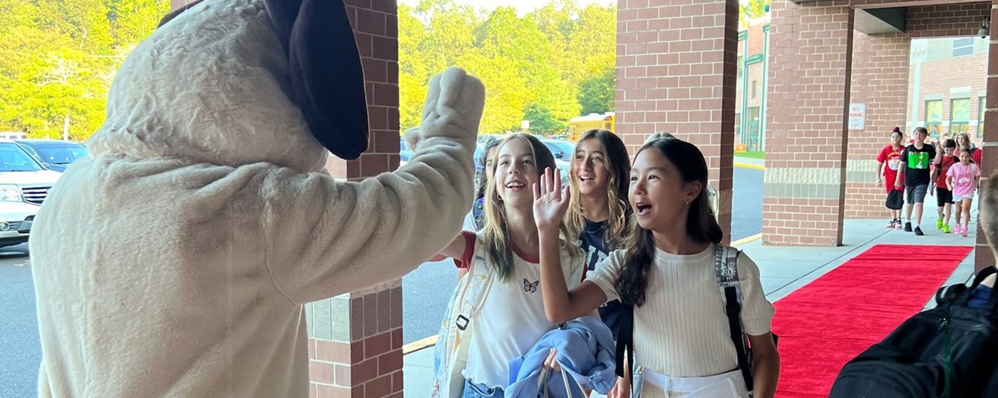Students greeting the Hound on the first day of school.