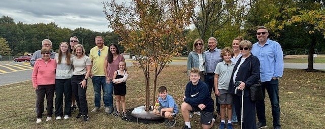 Tree planting honors former Superintendent Merz